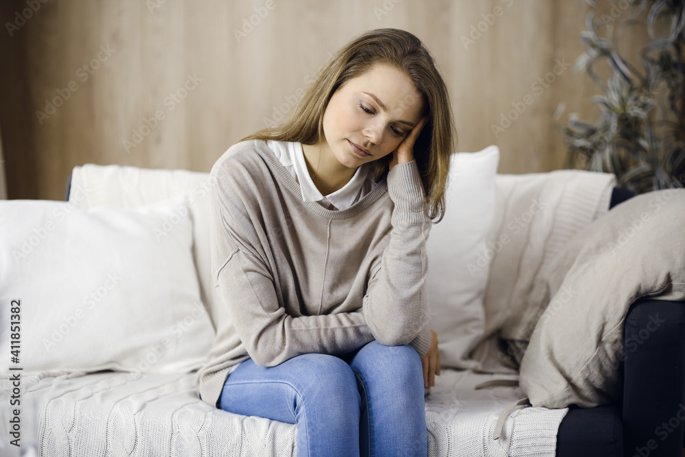Tired upset woman worried about tiredness from work at home office and self isolation quarantine for COVID-19 Coronavirus. Mental health, anxiety depressed thinking young lady Tired upset woman worried about tiredness from work at home office and self isolation quarantine for COVID-19 Coronavirus. Mental health, anxiety depressed thinking young lady