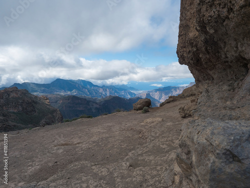View from foot of Roque Nublo rock formation in inland central volcanic mountains from famoust Gran Canaria hiking trail. Canary Islands, Spain.