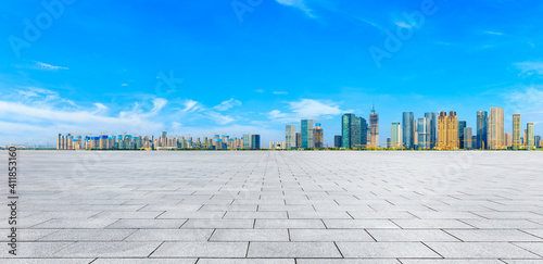 Empty square floor and modern city skyline with buildings in Hangzhou.