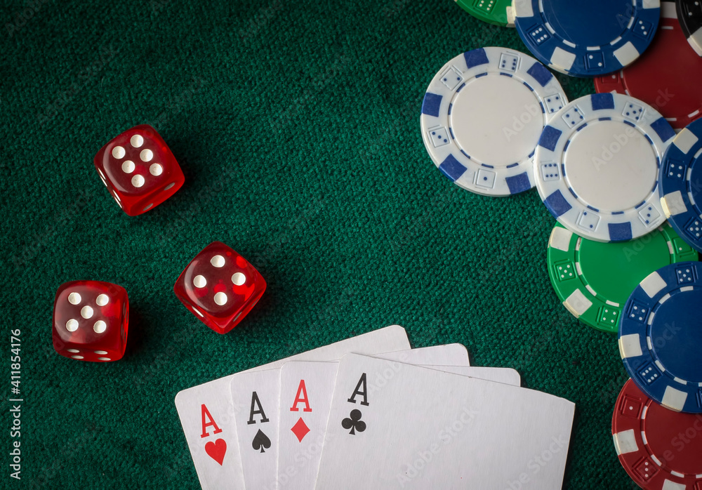 Fototapeta premium Stack of chips and two aces on the table on the green baize - poker game concept