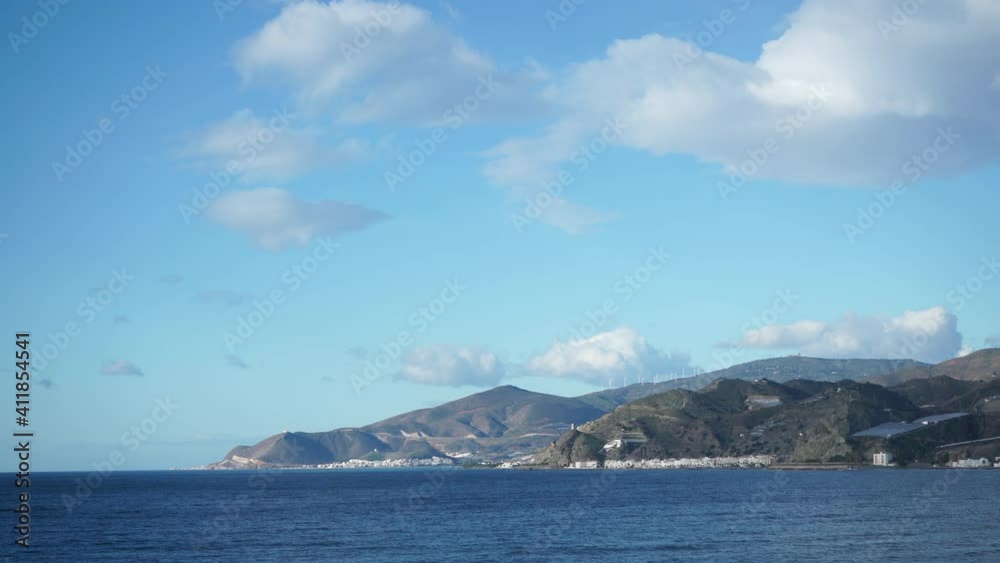 Time lapse clouds over spanish sea coast, view from parking rest area near Melicena, Granada, Spain.