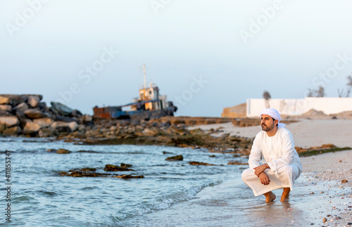 emirati man on the beach photo