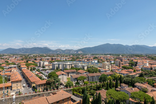 Panoramic view of Pisa city with historic buildings and far away mountains © TravelFlow