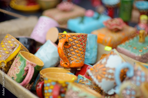 Ceramic dishes, tableware and jugs sold on Easter market in Vilnius. Lithuanian capital's traditional crafts fair is held every March on Old Town streets. © MNStudio