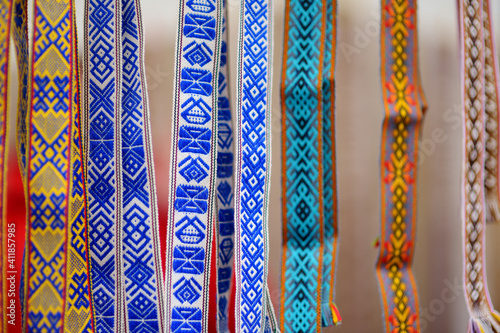 Details of a traditional Lithuanian weave. Woven belts as a part of national Lithuanian costume sold on traditional Easter fair in Vilnius, Lithuania