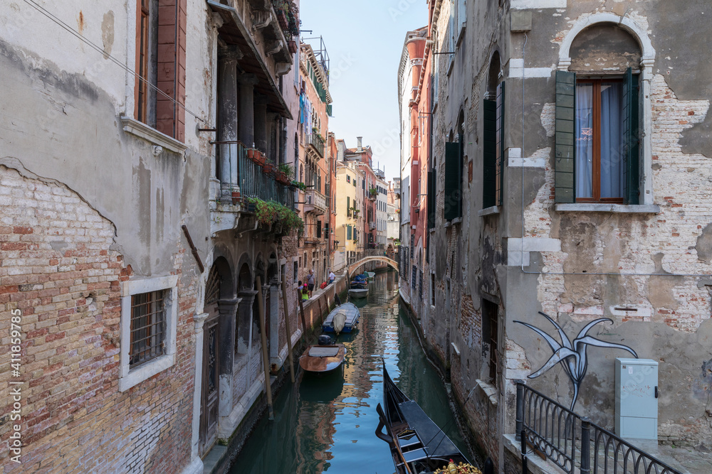 Fototapeta Panoramic view of Venice narrow canal with historical buildings and boat
