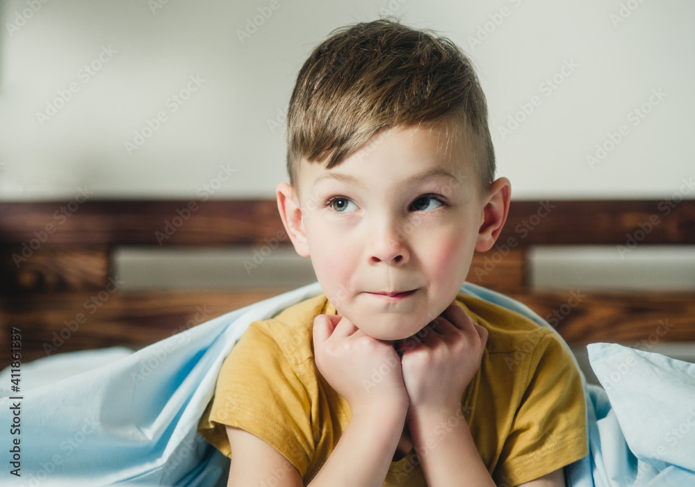 little boy lying on the bed little boy lying on the bed