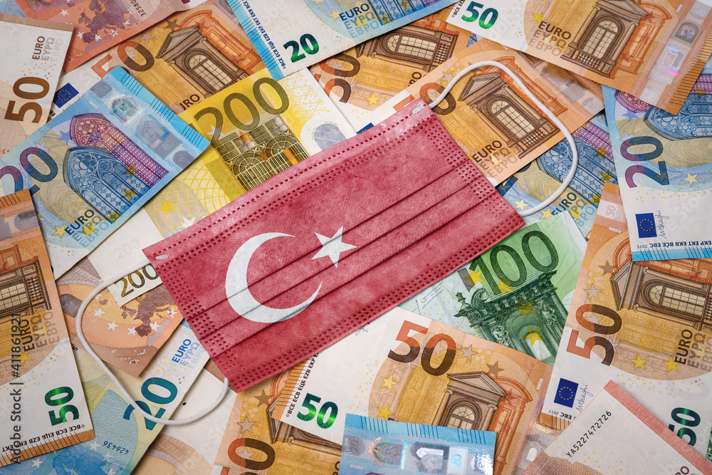 Medical mask with the flag of Turkey on a variety of european banknotes.(series) Medical mask with the flag of Turkey on a variety of european banknotes.(series)