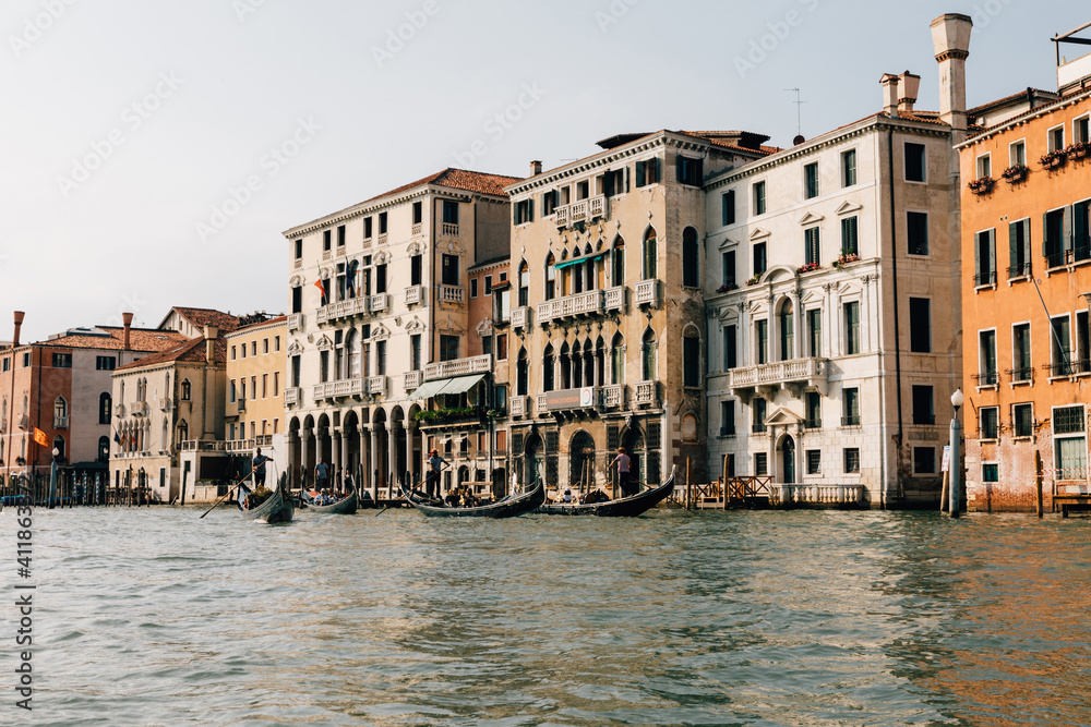 Panoramic view of Grand Canal (Canal Grande) with active traffic gondolas