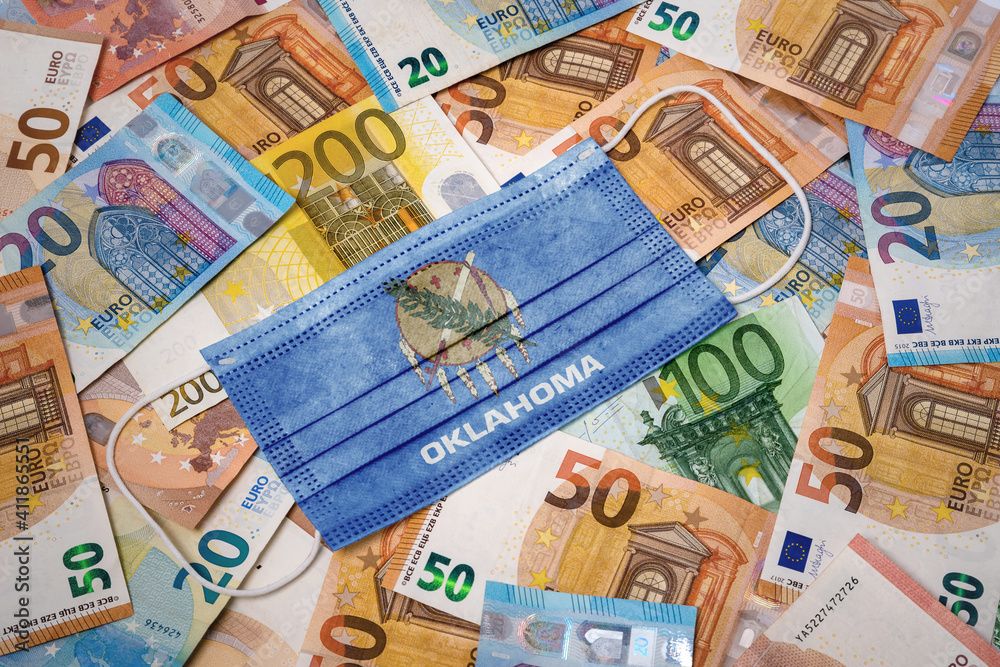 Medical mask with the flag of Oklahoma on a variety of european banknotes.(series) Medical mask with the flag of Oklahoma on a variety of european banknotes.(series)