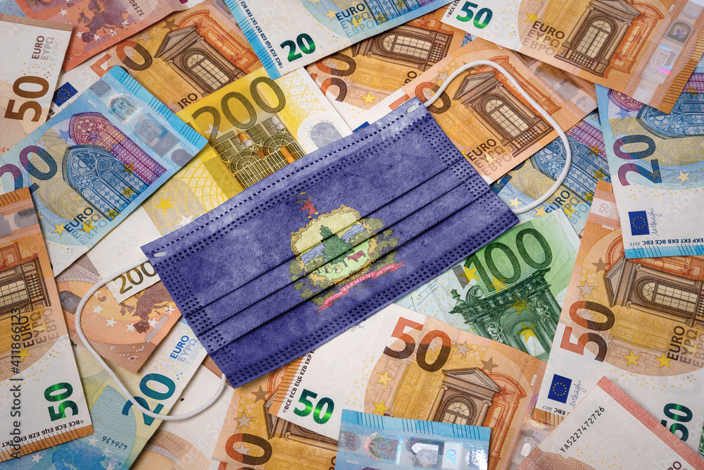 Medical mask with the flag of Vermont on a variety of european banknotes.(series) Medical mask with the flag of Vermont on a variety of european banknotes.(series)