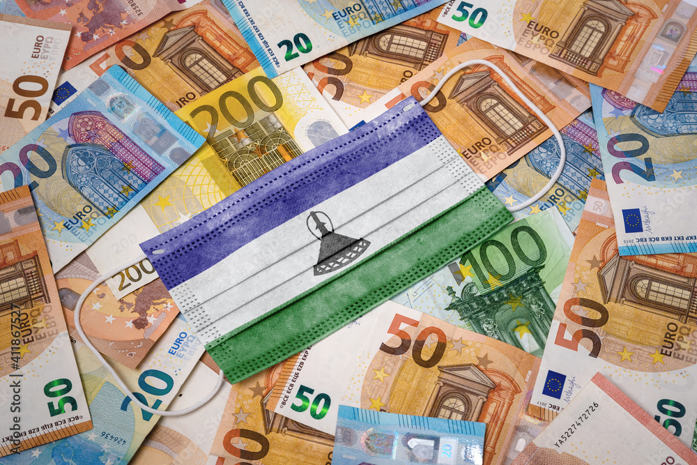 Medical mask with the flag of Lesotho on a variety of european banknotes.(series) Medical mask with the flag of Lesotho on a variety of european banknotes.(series)