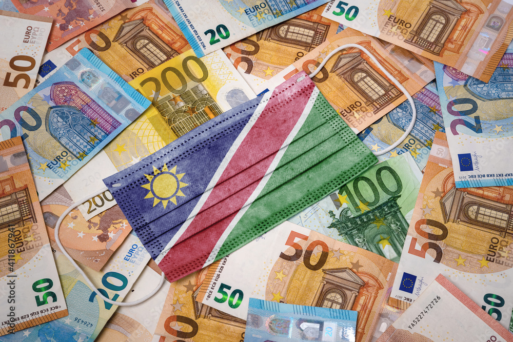 Medical mask with the flag of Namibia on a variety of european banknotes.(series) Medical mask with the flag of Namibia on a variety of european banknotes.(series)