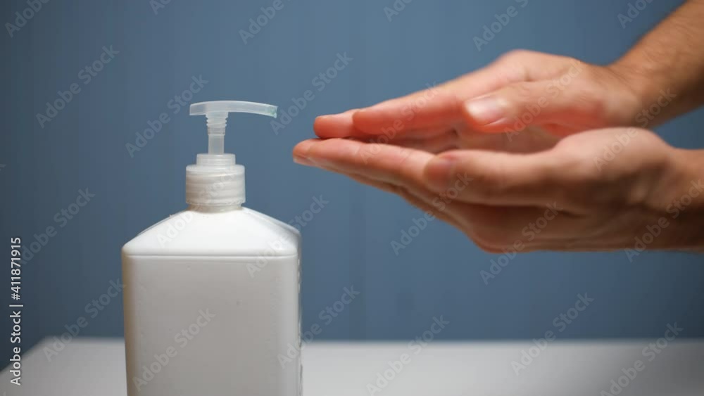 Man showing hand hygiene washing hands with hand sanitizer for coronavirus germs spreading protection. Man showing hand hygiene washing hands with hand sanitizer for coronavirus germs spreading protection.