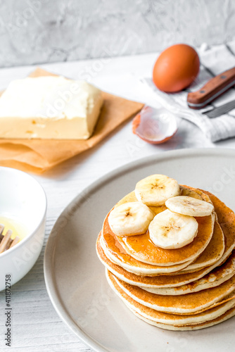 cooked pancake on plate at wooden background