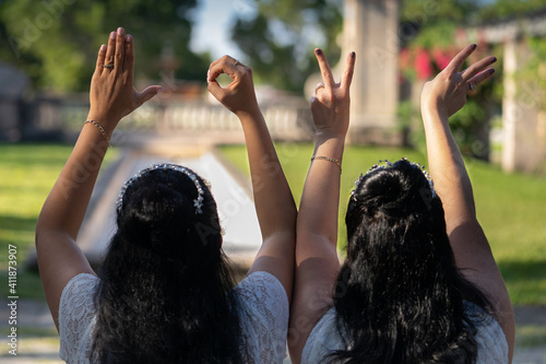 Women hands writing LOVE sign in the air