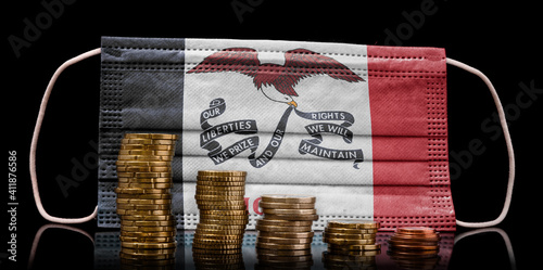 Medical mask with the flag of Iowa behind some shrinking stacks of various coins.(series) photo