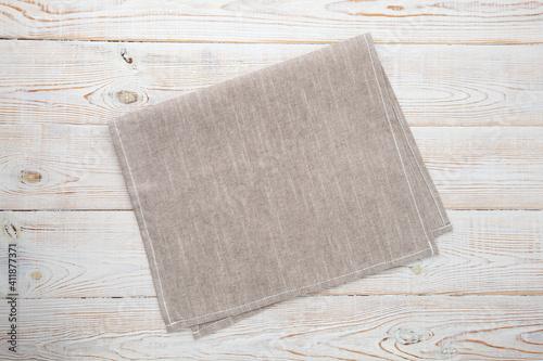 Empty canvas napkin on wooden desk top view
