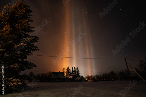 Light Pillars result from a rare meteorological phenomena. Winter nature landscape.
