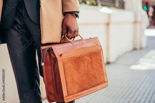 Business man holding a briefcase.