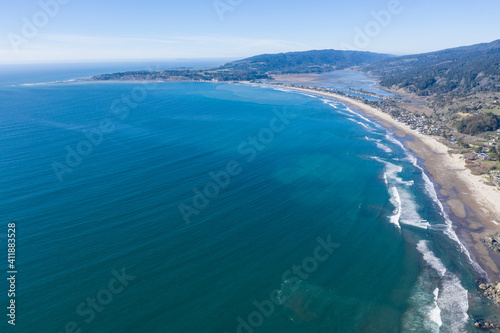 North of San Francisco, the Pacific Ocean washes against the shoreline of Stinson Beach on a beautiful winter day. The scenic Pacific Coast Highway runs along much of the edge of California. © ead72