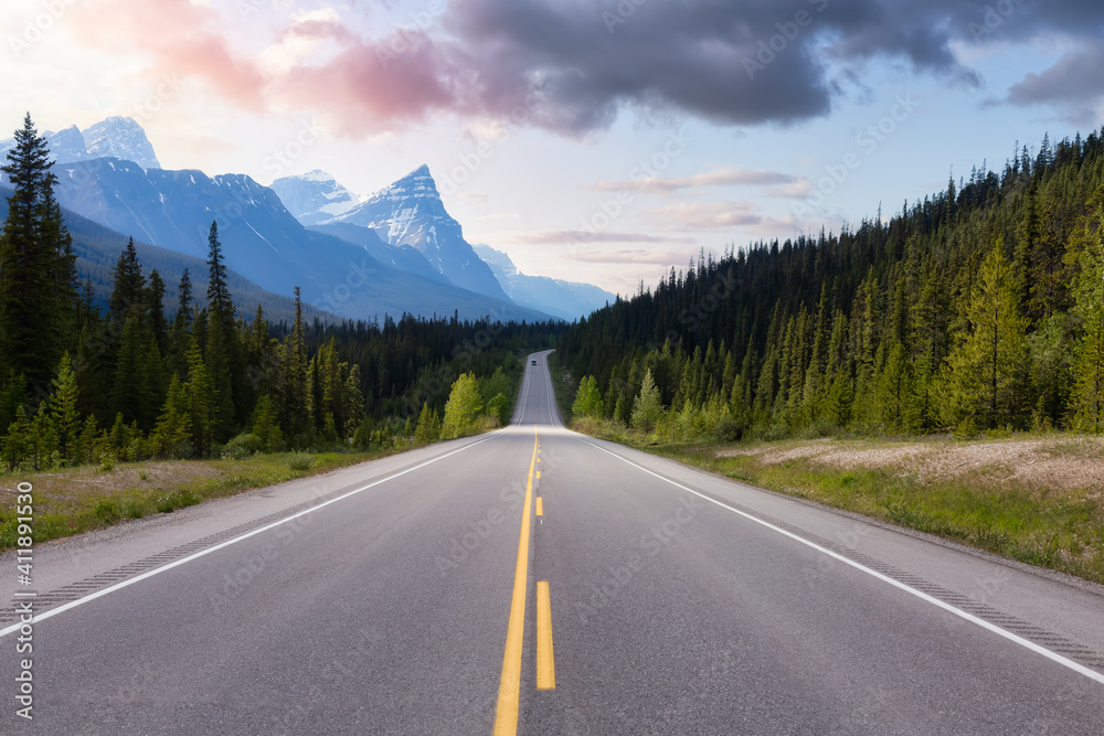 Naklejka premium Scenic road in the Canadian Rockies. Colorful Sunset Sky Art Render. Taken in Icefields Parkway, Banff National Park, Alberta, Canada. Panorama Background