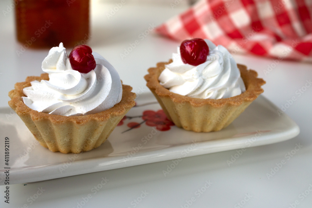 Cake basket with whipped protein cream cherry jam in a basket of shortbread dough is perfect for a tea party Cake basket with whipped protein cream cherry jam in a basket of shortbread dough is perfect for a tea party