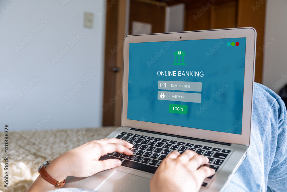 Online banking concept.Female hands using computer or laptop at home Online banking concept.Female hands using computer or laptop at home