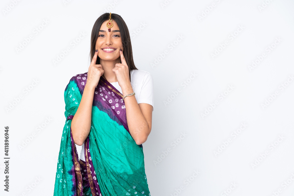 Young Indian woman isolated on white background smiling with a happy and pleasant expression Young Indian woman isolated on white background smiling with a happy and pleasant expression