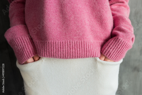 Pink warm sweater and white skirt with pockets