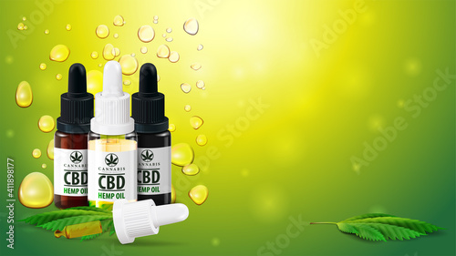 Blank template with copy space, CBD oil bottles with pipette and marijuana leafs on blurred green background with Cannabis oil gold bubbles.