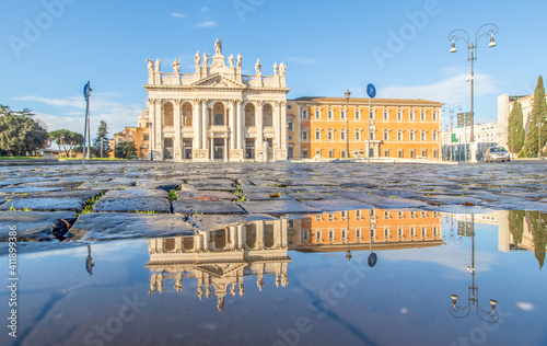 Rome, Italy - in Winter time, frequent rain showers create pools in which the wonderful Old Town of Rome reflects like in a mirror. Here in particular the San Giovanni Basilica  photo