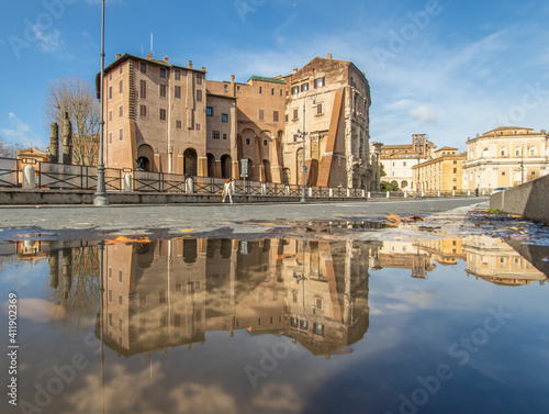  Rome, Italy - in Winter time, frequent rain showers create pools in which the wonderful Old Town of Rome reflects like in a mirror. Here in particular the Theatre of Marcellus