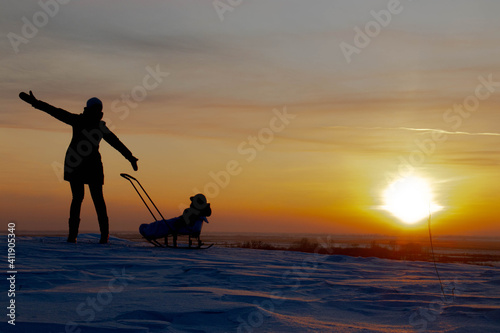  winter landscape, evening, sunset, north, frost, silhouette of a woman with a child, joy