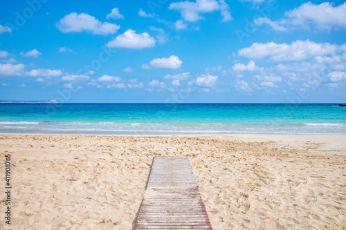 Fototapeta Naklejka Na Ścianę i Meble -  Landmark sea tourist attraction Makronisos bay with golden sand beach at Ayia Napa in Cyprus. Swimming in turquoise sea water, relaxing and sunbathing