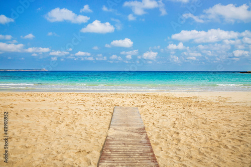 Fototapeta Naklejka Na Ścianę i Meble -  Landmark sea tourist attraction Makronisos bay with golden sand beach at Ayia Napa in Cyprus. Swimming in turquoise sea water, relaxing and sunbathing