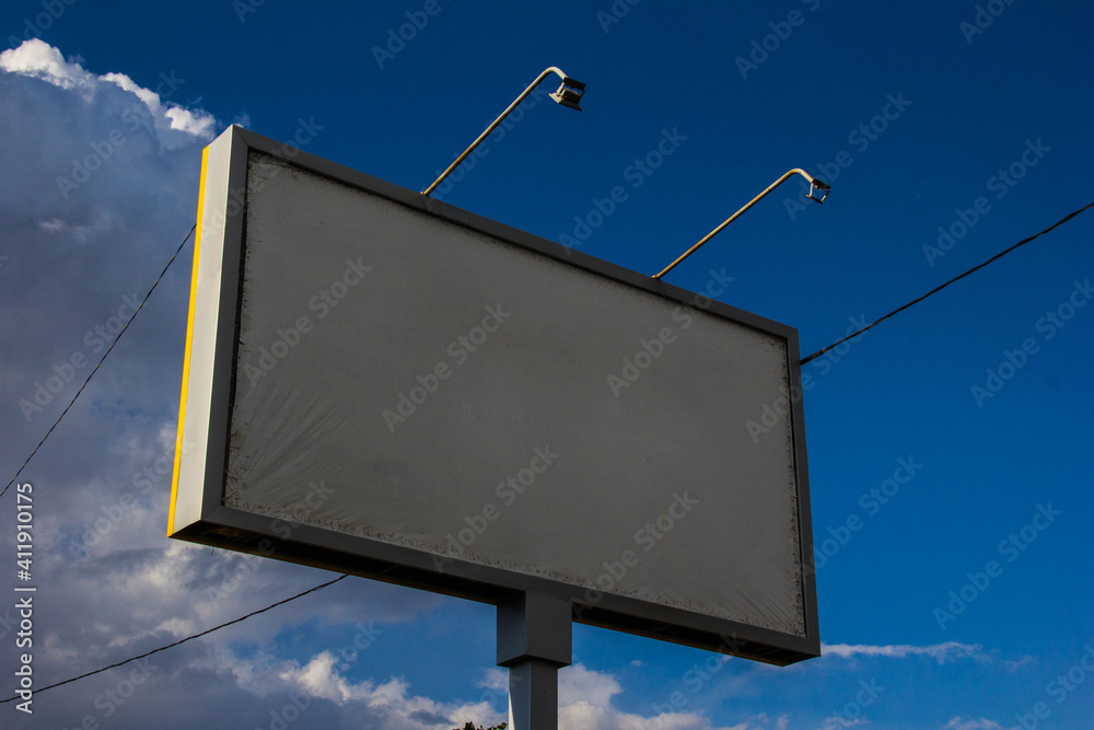 Billboard on the background of a blue summer sky. Billboard on the background of a blue summer sky.