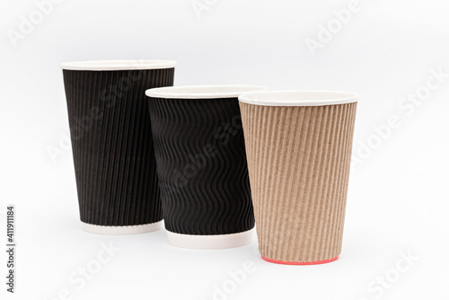 three cardboard empty cups for coffee on a white background