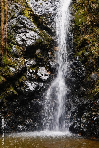  Landscape of a small waterfall inside a cave