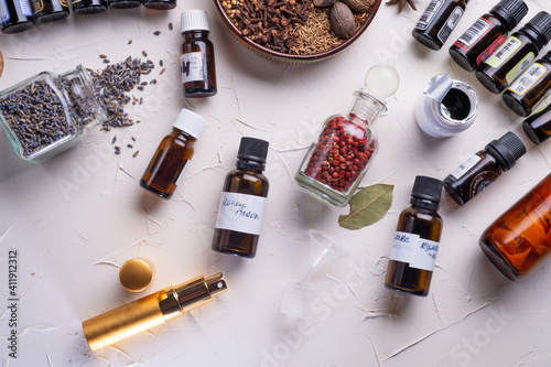  perfume ingridients around white background. Perfumer. beauty and trendy concept.   flat lay