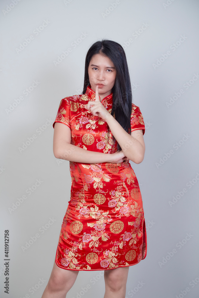 Asian woman wearing traditional cheongsam qipao Asian woman wearing traditional cheongsam qipao