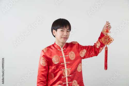 Young Asian man holding chinese lucky word photo