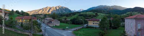 Panoramic of the Naranjo de Bulnes at sunset, known as Picu Urriellu, viewed from Las Arenas in Cabrales, Picos de Europa National Park in Asturias, Spain.