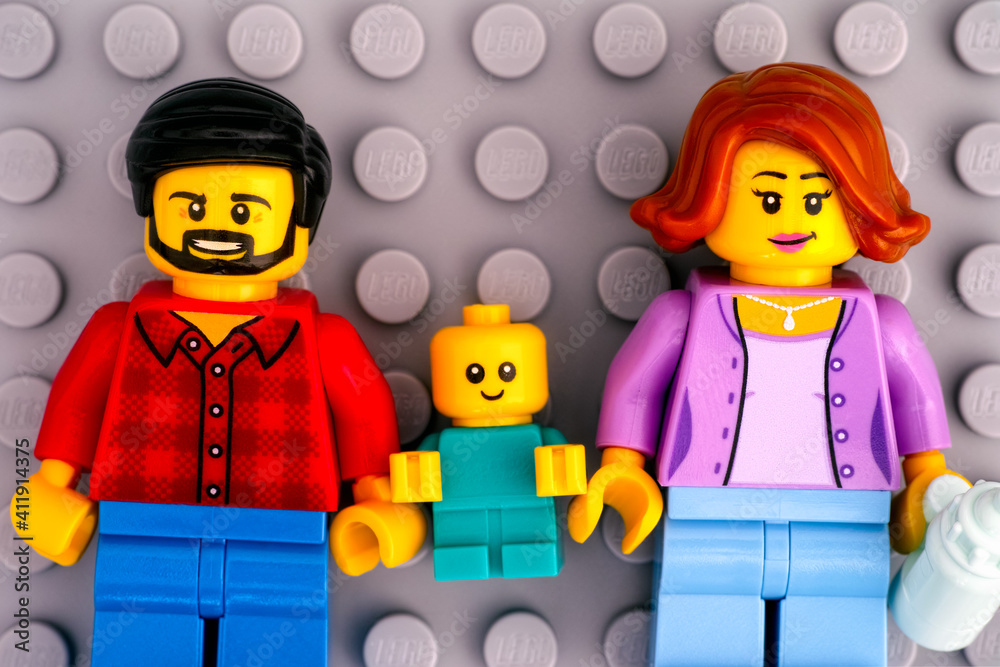 Tambov, Russian Federation - January 17, 2021 Lego family - father, mother  and baby minifigures on gray baseplate background. Stock Photo | Adobe Stock