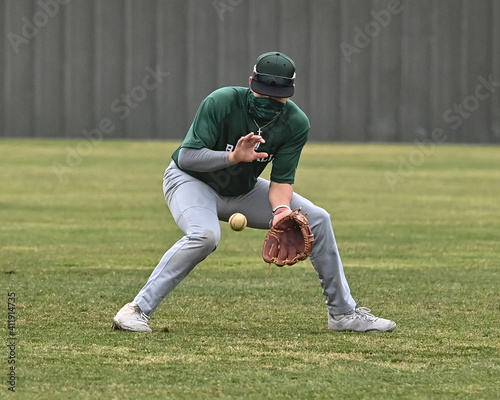 Photography Action photo of high school baseball players making amazing plays during a baseb