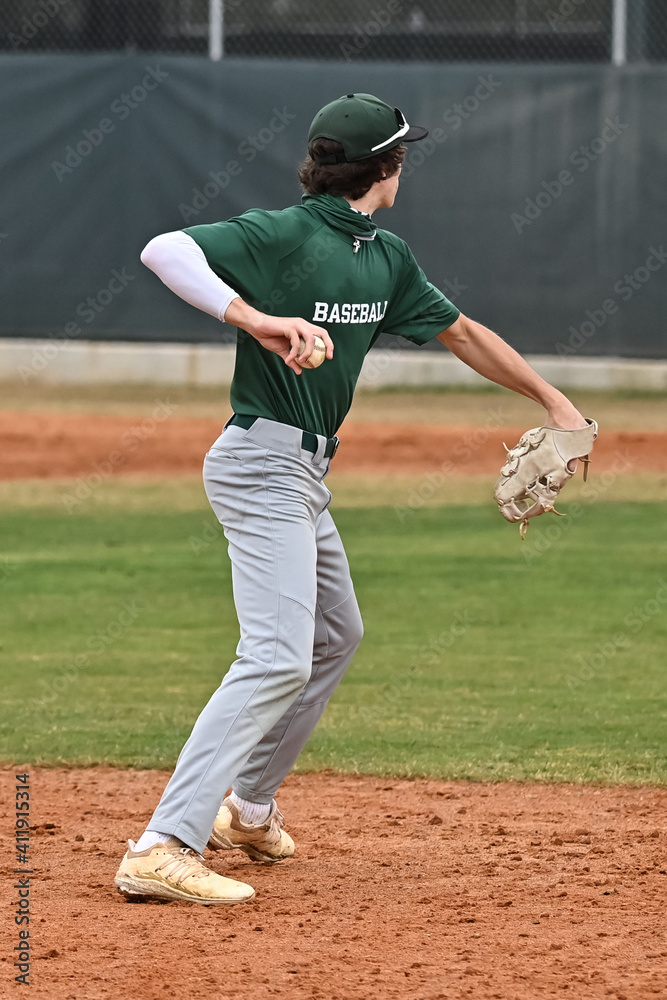 Action photo of high school baseball players making amazing plays during a baseball game Action photo of high school baseball players making amazing plays during a baseball game