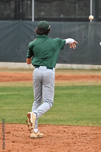 Photography Action photo of high school baseball players making amazing plays during a baseb