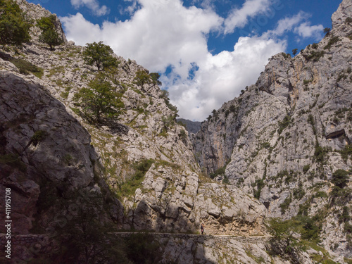 The Cares Route in the heart of Picos de Europa National Park, Cain-Poncebos, Asturias, Spain. Narrow and impressive canyon between cliffs, bridges, caves, footpaths and rocky mountains.