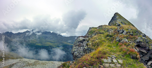 hiking path on the so called Zettersfeld with the peak of the mountain Goisele near Lienz, Austria photo