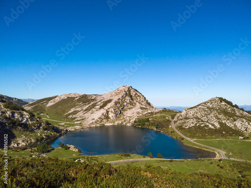 The Lakes of Covadonga. The Lake Enol is a small highland lake in the Principality of Asturias, Spain. It is located in the Picos de Europa Western Massif, Cantabrian Mountains.